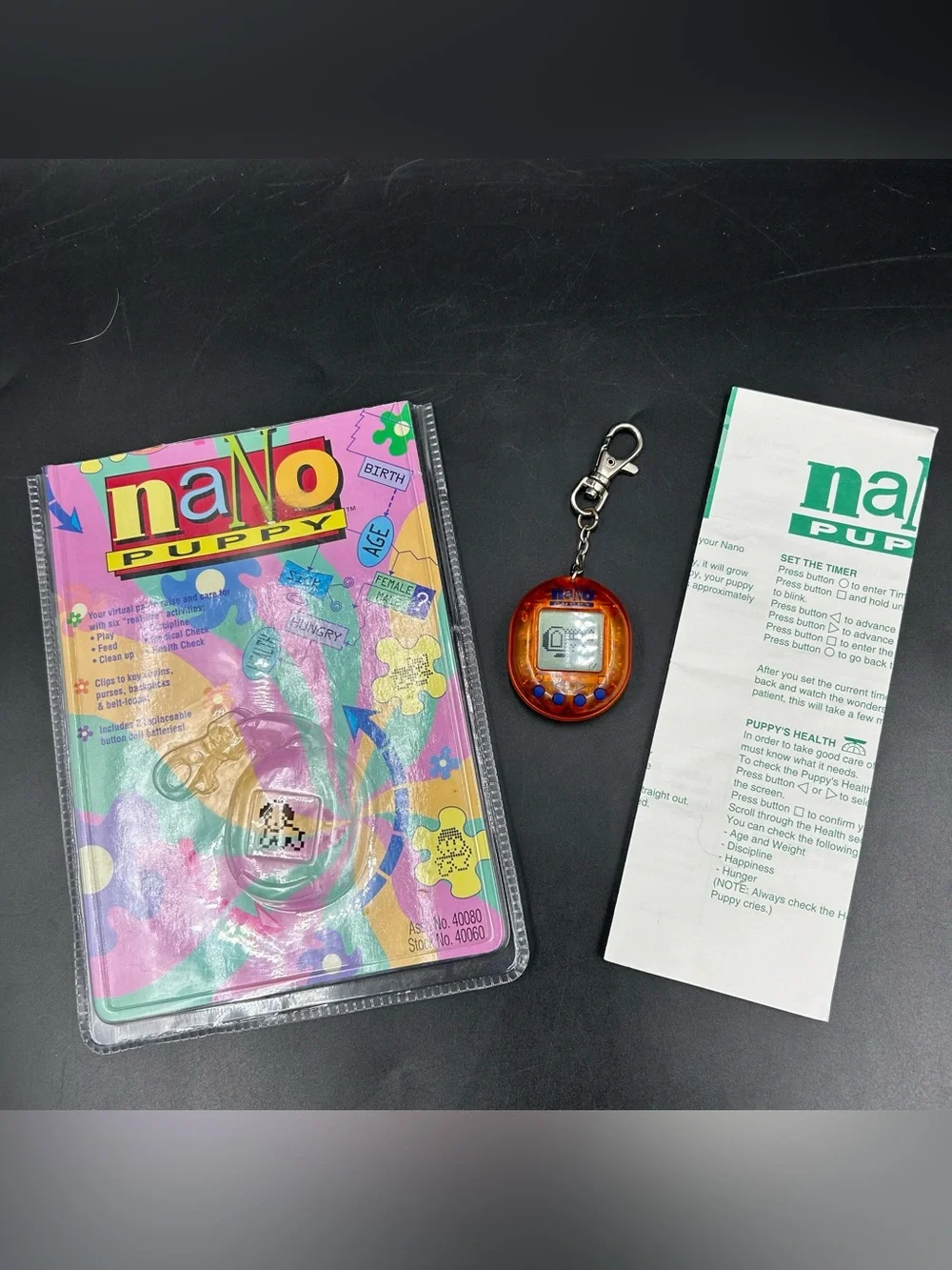 Vintage 1997 Nano Puppy Orange Virtual Pet Playmates Working Package Manual